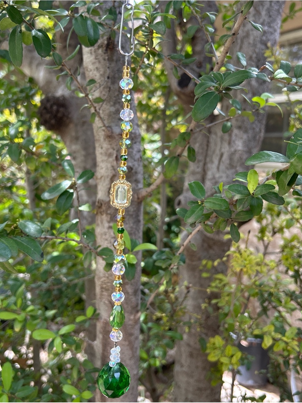 Handmade green and peridot green crystal beaded strand suncatcher